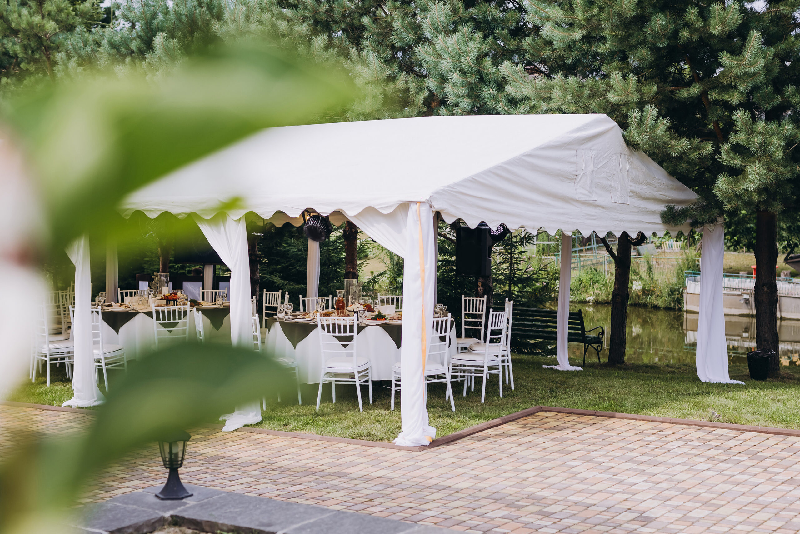 White canopy tent with tables and chairs